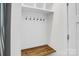 Mud room with bench, coat hooks, and overhead storage at 13332 Caite Ridge Rd, Davidson, NC 28036