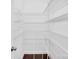 Pantry features white wire shelving and dark hardwood floors at 13332 Caite Ridge Rd, Davidson, NC 28036