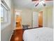 Bedroom view showcasing hardwood floors, bathroom entry and closet access at 137 Burton Hills Cir, Gastonia, NC 28054