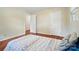 Spacious bedroom with hardwood floors, two closets, and doorways visible at 137 Burton Hills Cir, Gastonia, NC 28054