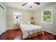 Bedroom with hardwood floors, two windows, a ceiling fan and neutral walls at 137 Burton Hills Cir, Gastonia, NC 28054