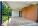 Covered carport area attached to brick home featuring ample parking space and backyard access at 137 Burton Hills Cir, Gastonia, NC 28054