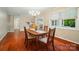 Dining room shows a table with 4 chairs, wood flooring, a chandelier and natural light at 137 Burton Hills Cir, Gastonia, NC 28054