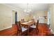 The dining room has wood floors, natural light and is open to the kitchen at 137 Burton Hills Cir, Gastonia, NC 28054