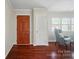 Inviting entryway featuring hardwood floors, coat closet, and living room access at 137 Burton Hills Cir, Gastonia, NC 28054