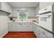 Bright kitchen with neutral-toned cabinets, hardwood floors, and natural light at 137 Burton Hills Cir, Gastonia, NC 28054