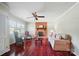 Cozy living room with brick fireplace, hardwood floors, and abundant natural light at 137 Burton Hills Cir, Gastonia, NC 28054