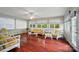 The living room is bright and has hardwood floors and wicker furniture at 137 Burton Hills Cir, Gastonia, NC 28054