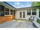 A wooden patio features double doors and multiple windows for natural light and outdoor access at 137 Burton Hills Cir, Gastonia, NC 28054