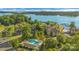 Aerial view showcasing community with lake access, pool, lush greenery, perfect for nature lovers and water enthusiasts at 13932 Queens Harbor Rd, Charlotte, NC 28278