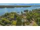 Aerial view of condos with pool and lake access, perfect for those seeking waterfront living and community amenities at 13932 Queens Harbor Rd, Charlotte, NC 28278