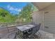 Private balcony with dining table and chairs, perfect for enjoying the outdoors at 13932 Queens Harbor Rd, Charlotte, NC 28278