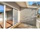Exterior image of a deck with sliding glass doors leading to an interior room with wood floors at 13932 Queens Harbor Rd, Charlotte, NC 28278