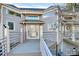 Close-up of front entrance, featuring glass door and wood deck at 13932 Queens Harbor Rd, Charlotte, NC 28278