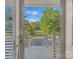 Inviting entrance with view to the outdoors, featuring a gazebo and lush greenery under a bright blue sky at 13932 Queens Harbor Rd, Charlotte, NC 28278