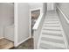 Inviting entryway featuring tile flooring and staircase access to upper level at 13932 Queens Harbor Rd, Charlotte, NC 28278