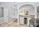 Spacious kitchen with a wine cooler and stainless steel appliances opens to a living space at 13932 Queens Harbor Rd, Charlotte, NC 28278
