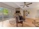 Inviting living room featuring a stone fireplace, wood floors, and balcony access at 13932 Queens Harbor Rd, Charlotte, NC 28278