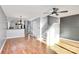 Open-concept living area offering hardwood floors and staircase access at 13932 Queens Harbor Rd, Charlotte, NC 28278
