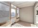 Screened porch with wooden slat walls and view of the neighborhood at 13932 Queens Harbor Rd, Charlotte, NC 28278