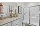 Well-lit bathroom with white cabinets, shower and stylish fixtures at 149 Glenn Dr, Mooresville, NC 28115