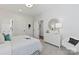 Bright bedroom featuring a decorative mirror, dresser, and comfortable bed at 149 Glenn Dr, Mooresville, NC 28115