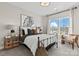 Cozy bedroom with large windows, neutral walls and a metal bed frame at 149 Glenn Dr, Mooresville, NC 28115