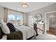 Comfortable bedroom with lots of natural light, hard wood dresser and modern decor at 149 Glenn Dr, Mooresville, NC 28115
