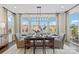 The dining room features modern lighting, lots of windows, and seating for six at 149 Glenn Dr, Mooresville, NC 28115