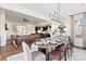 Open concept dining area with hardwood floors, a large window, and views into the kitchen at 149 Glenn Dr, Mooresville, NC 28115