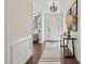 Elegant foyer boasts hardwood floors, wainscoting, and a stylish pendant light at 149 Glenn Dr, Mooresville, NC 28115