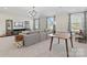 Spacious living room featuring a sectional sofa, modern decor, and entertainment center at 149 Glenn Dr, Mooresville, NC 28115