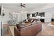 Open concept living area that flows into the kitchen with views of the staircase and front entry at 149 Glenn Dr, Mooresville, NC 28115