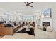 Spacious living room featuring leather sofas, a modern fireplace, and ample lighting at 149 Glenn Dr, Mooresville, NC 28115