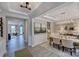 Open dining room featuring stylish chandelier, elegant furnishings, and seamless transition into living spaces at 153 Glenn Dr, Mooresville, NC 28115