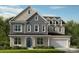Charming two-story home with a manicured lawn, a mix of horizontal and vertical siding, and a two-car garage at 153 Glenn Dr, Mooresville, NC 28115