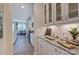 Elegant kitchen with white cabinets, granite countertops, and stainless steel appliances offers modern convenience at 153 Glenn Dr, Mooresville, NC 28115