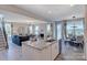 Open floor plan connecting kitchen, dining, and living areas, creating a seamless and inviting space at 153 Glenn Dr, Mooresville, NC 28115