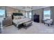 Luxurious main bedroom with tray ceiling, comfortable bed, and sophisticated decor creates serene retreat at 153 Glenn Dr, Mooresville, NC 28115