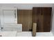 Selection of interior design materials including white cabinetry, neutral tile, and light and dark tone wood samples at 153 Glenn Dr, Mooresville, NC 28115