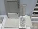Selection of interior design materials including grey cabinetry, neutral tile and floor samples at 153 Glenn Dr, Mooresville, NC 28115