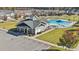Community pool with clubhouse and parking with lush landscaping and surrounding neighborhood at 153 Glenn Dr, Mooresville, NC 28115