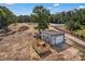 Wide-angle aerial view showcases a shed, wooden structure, outbuilding, and land with surrounding trees at 159 Old Home Pl, China Grove, NC 28023