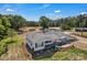 Aerial shot showcasing a one-story home with a carport, manicured front yard, and a spacious lot at 159 Old Home Pl, China Grove, NC 28023