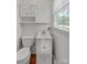 Clean white half bathroom with classic fixtures and natural light at 159 Old Home Pl, China Grove, NC 28023