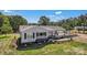 Attractive one-story home with grey siding, black shutters, a welcoming porch, and convenient carport at 159 Old Home Pl, China Grove, NC 28023
