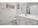 Bright bathroom with a white vanity, framed artwork and a decorative Eiffel Tower shower curtain at 16112 Lakeside Loop Ln, Cornelius, NC 28031