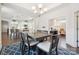 Open-concept dining area leading to the kitchen and office space at 16112 Lakeside Loop Ln, Cornelius, NC 28031
