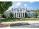 Charming home exterior with symmetrical design, manicured lawn, and inviting front entrance at 16112 Lakeside Loop Ln, Cornelius, NC 28031
