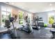 Well-equipped gym with treadmill, elliptical, and stationary bike for fitness enthusiasts at 16112 Lakeside Loop Ln, Cornelius, NC 28031